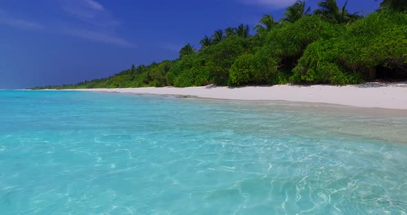 Beautiful birds eye island view of a summer white paradise sand beach and aqua turquoise water backg