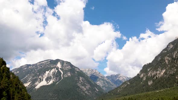 Time Lapse of Mountain Landscape with Moving Clouds