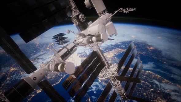 A View of the Earth and a Spaceship. ISS Is Orbiting the Earth alt