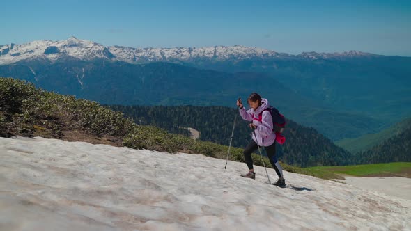 Woman Mountaineer Climbing Dangerous Slippery Hillside