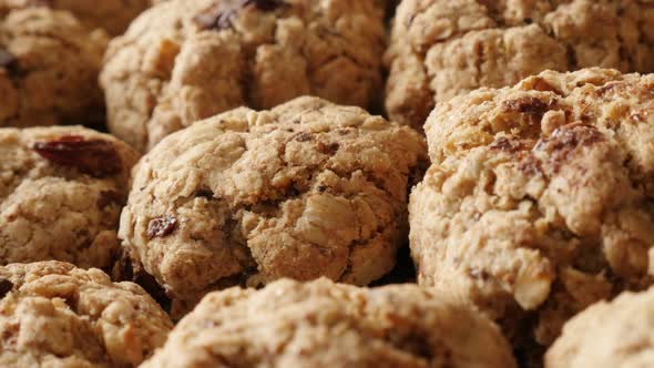 Fresh chocolate chip cookies on pile close-up slow pan 4K 2160p 30fps UHD footage - Oatmeal homemade