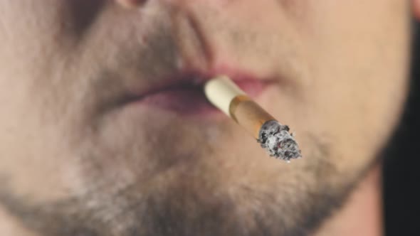 Businessman Smoking a Cigarette. Close Up