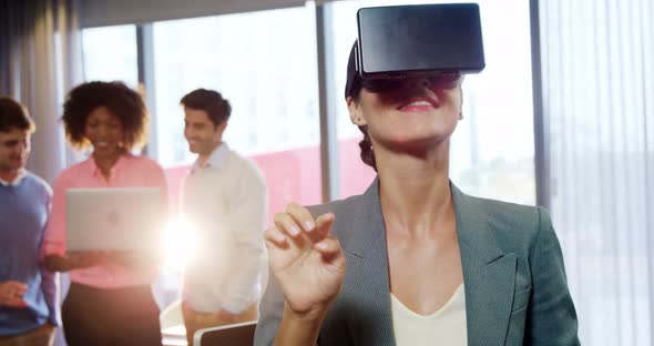 Businesswoman using the virtual reality headset