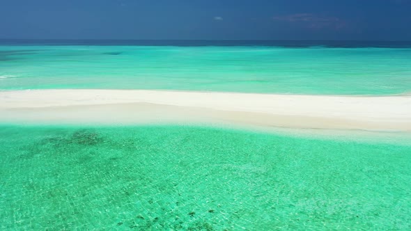 Wide angle flying abstract view of a summer white paradise sand beach and aqua turquoise water background