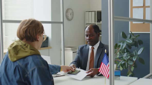 Man Applying for US Visa in Consulate