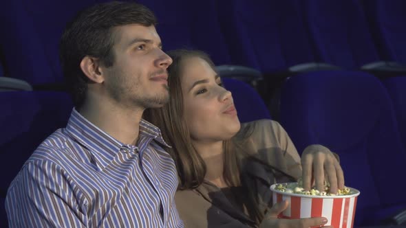 Sweet Couple Watching Romantic Comedy at the Cinema