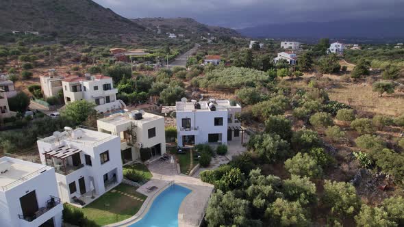 Luxurious Wealthy Neighborhood, Beautiful Homes in Crete Greece. Aerial Pan Out View.