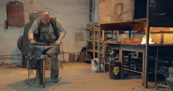 Brutal Blacksmith Takes Out of the Oven Wooden Board