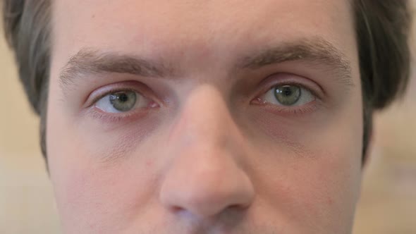 Close Up of Blinking Eyes of Young Man