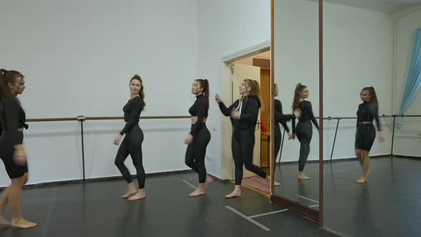 Wide Shot of Slim Cheerful Young Caucasian Women Entering Dancing Studio