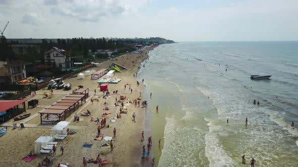 Aerial View of Beach with Tourists