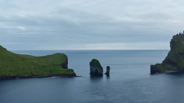 Drone Towards Drangarnir Sea Stacks In Faroe Islands