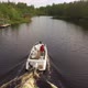 Camera Follows the Boat Sailing on the River Aerial Image - VideoHive Item for Sale
