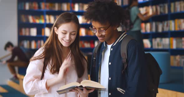 Multiethnic College Students Studying in Together School Library