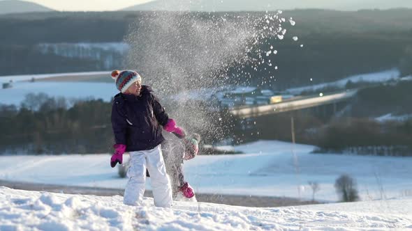 Slow Motion Young Girls Playing With Snow