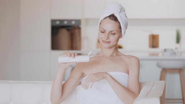 Young Female Holding Moisturizing Cream