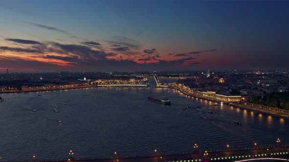 Flying Over The Night St. Petersburg River Embankments And Bridges