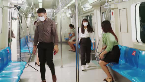 Crowd of People Wearing Face Mask on a Crowded Public Subway Train Travel