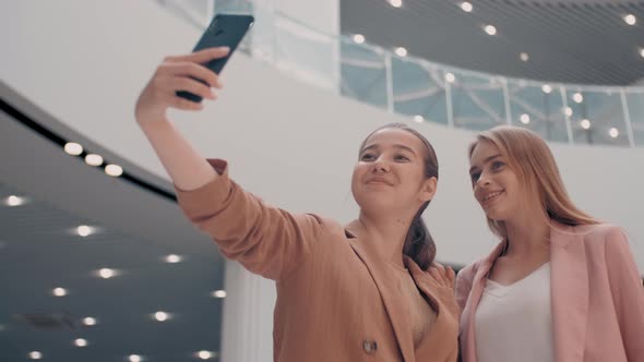 Happy Women Taking Selfie in Mall