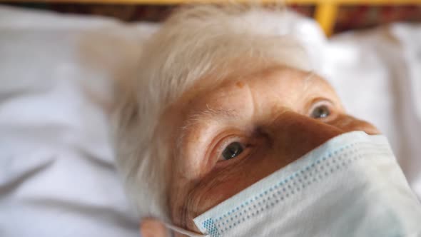 Close Up Face of Old Woman Wearing Protective Mask From Virus