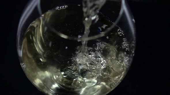 White Wine Being Poured Into a Wineglass, Bubble, View From Above, Black, Closeup, Slowmotion