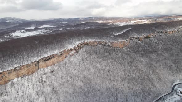 Aerial View of Plateau LagoNaki Mountain Twisted Road in the Winter and Driving Car