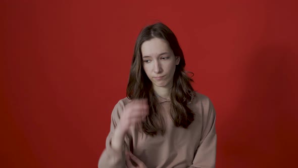 Portrait of a Thoughtful Young Woman with Long Hair Thinking Intensely Pondering a Solution to a