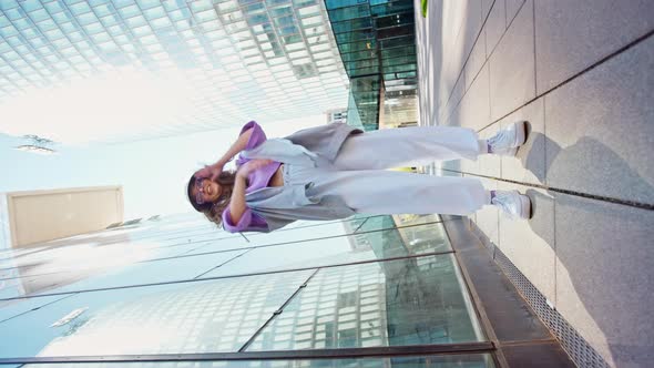 Fashionable Funky Caucasian Girl Dancer in Sportswear is Performing Outdoor Street Dancing Motion