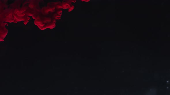 Red Paint Drops Falling in Water alt