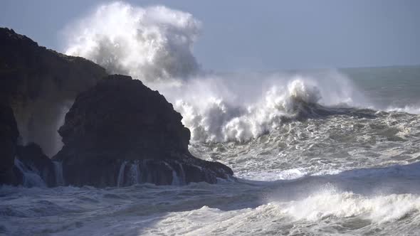 Ocean Storm. Stormy Waves Breaking Rocks. Slow Motion