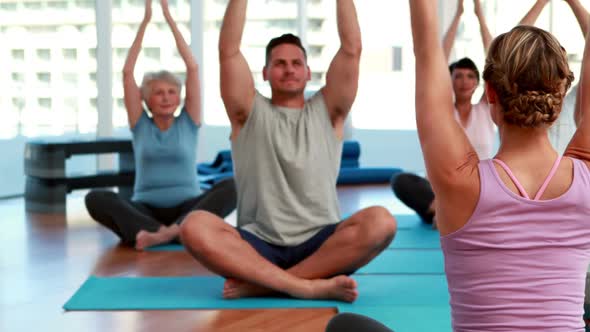 Yoga Class Sitting in Lotus Position