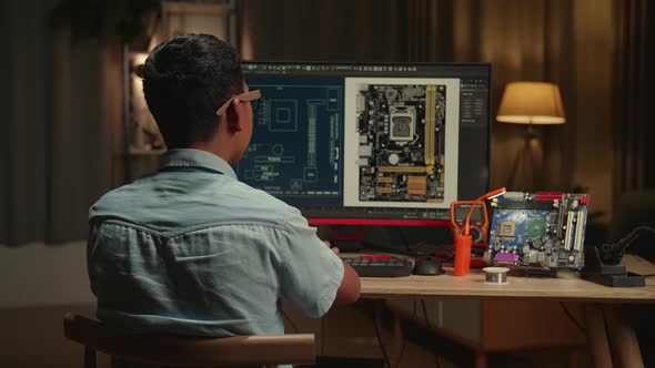Asian Boy Is Working With Desktop Computer In Home, Display Showing Cad Software, Genius Child