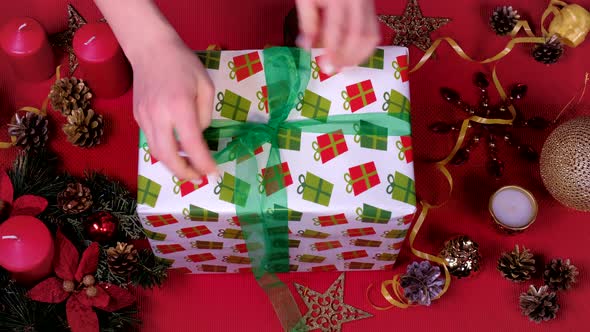 Close Up Woman Hand and Decorate Christmas Gift Box.