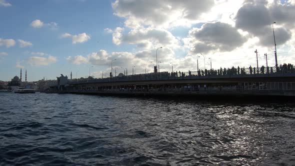 istanbul Karakoy District Galata Bridge cloudy day at sunset