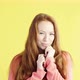 Studio portrait of beautiful young red-haired woman on yellow background - VideoHive Item for Sale