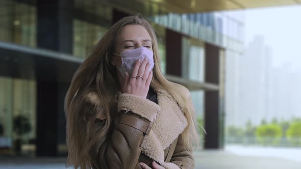 Woman Wearing Face Mask Because of Air Pollution or Virus Epidemic on the Street Background