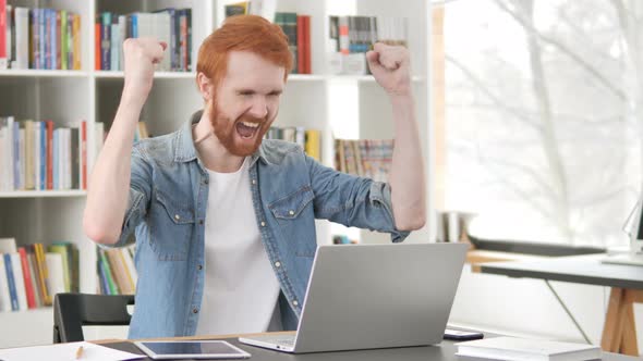 Casual Redhead Man Celebrating Success of Project