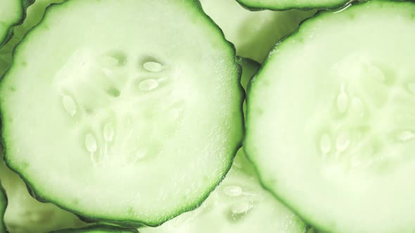 Slow Motion of Rotation Ripe Green Sliced Cucumbers