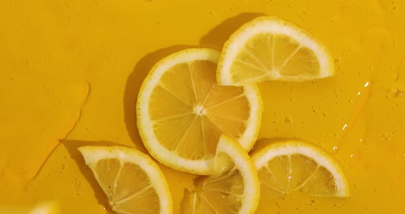 Top view rotation of fresh slice lemons pieces disappear