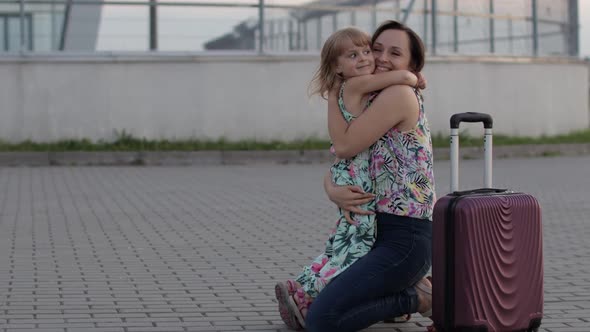 Mother Meet Her Daughter Child Near Airport Terminal with Open Arms After Long Flight Trip Work