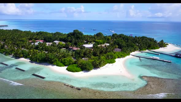 Aerial drone scenery of relaxing resort beach journey by blue ocean with white sandy background of a