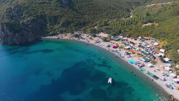 People swimming on the beach. Aerial video.