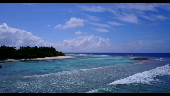 Aerial drone shot nature of perfect island beach vacation by turquoise lagoon and white sand backgro