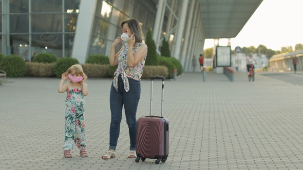 Coronavirus Pandemic, Covid-19 Ended. Daughter and Mother Tourists Takes Off Medical Mask. Vacations