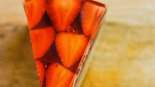 A Slice of Cake with Strawberries and Jelly