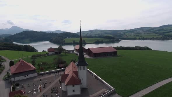 Aerial Flight Around The Church, Hautville Village, Switzerland