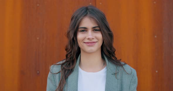 Close Up View of Pretty Happy Girl Smiling and Looking To Camera. Joyfull Millennial Woman in Casual