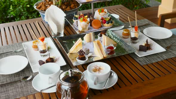 Traditional English Afternoon Tea Stand with Selection of Sweets  Cakes Snacks