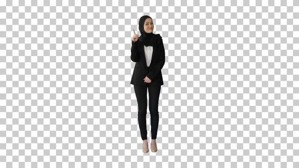 Arab businesswoman in hijab raising finger, Alpha Channel