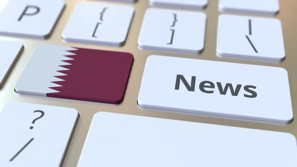 News Text and Flag of Qatar on the Keys of a Computer Keyboard